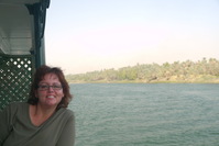 Andrea on her balcony sailing down the Nile