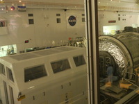 Workers working on International Space Station Modules..